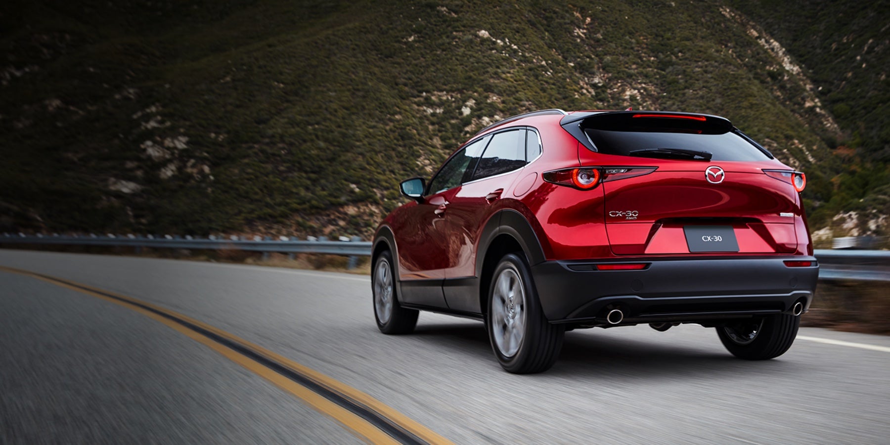 Red 2020 Mazda CX-30 Driving on the road | Flood Mazda in Wakefield, RI