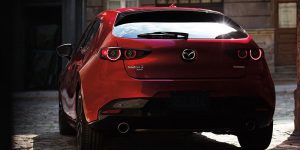 The striking back-end of a red 2020 Mazda 3 Hatchback.