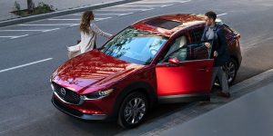 A red 2020 Mazda CX-30 parked on the street.