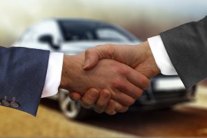 car loan shaking hands