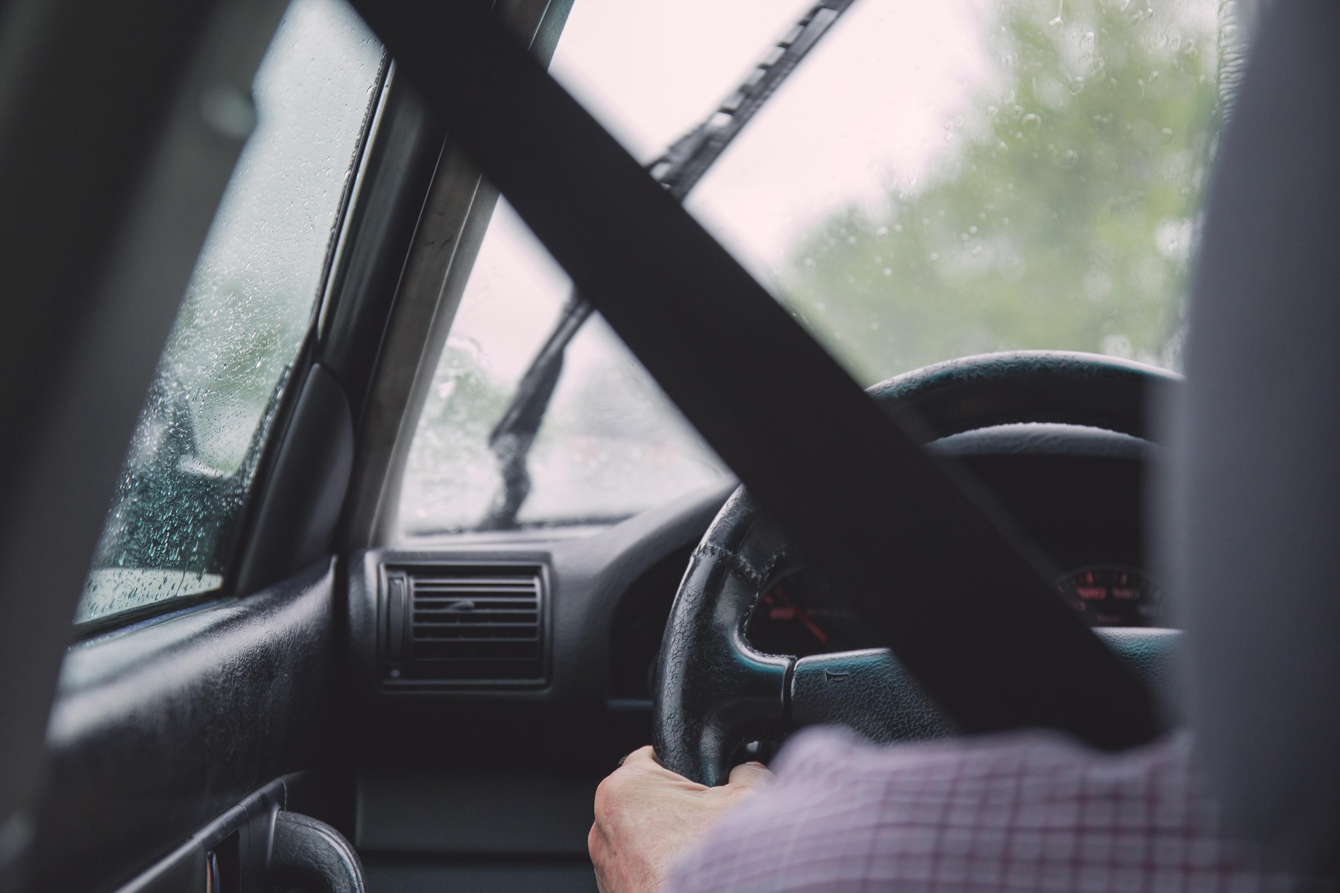 A person driving in the rain
