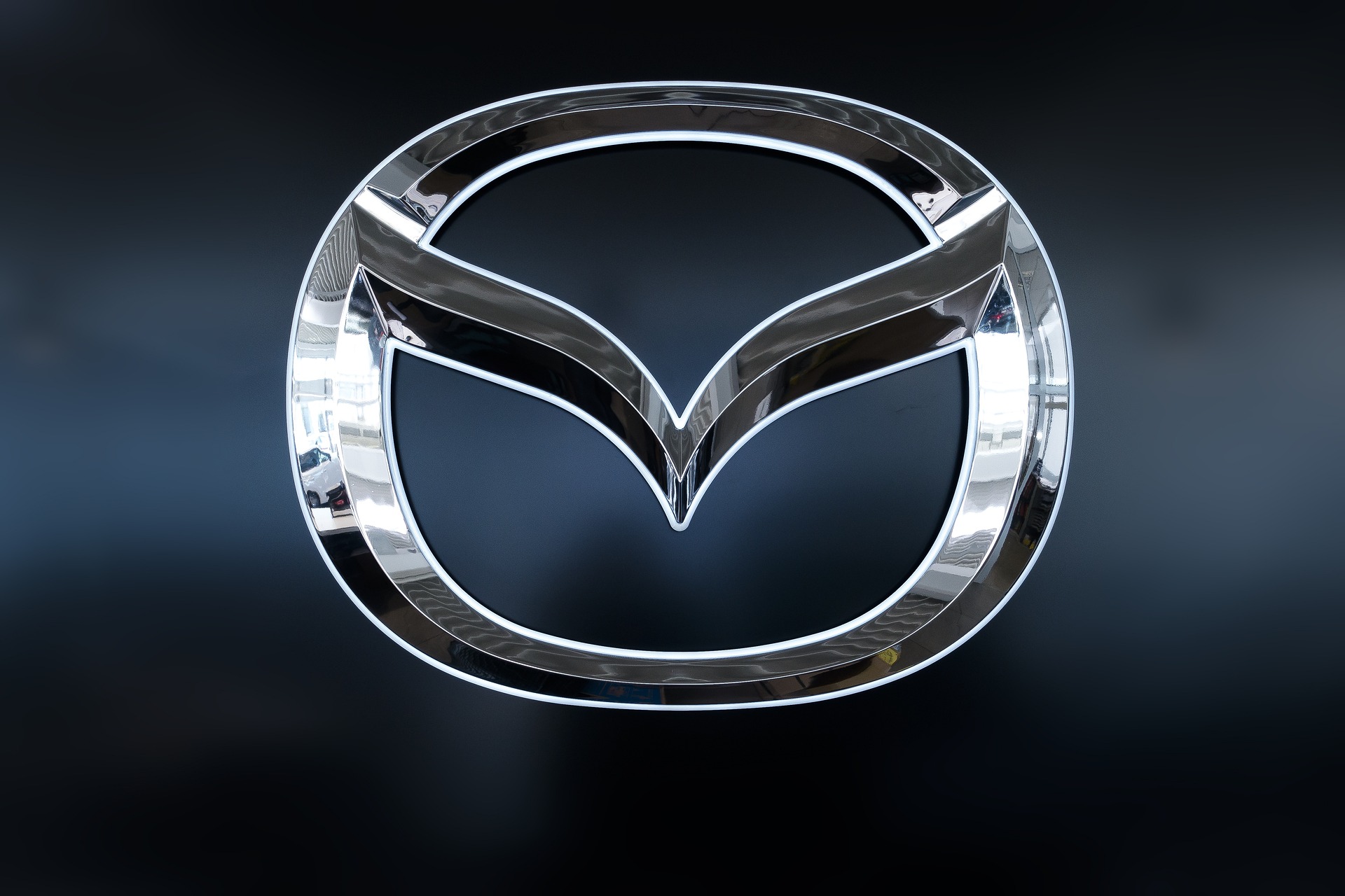 A glowing Mazda logo