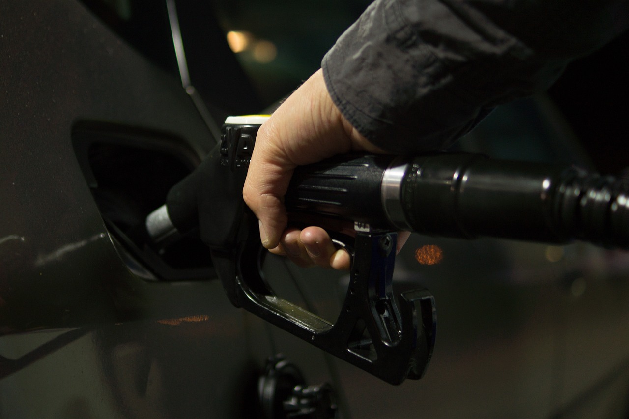 A person putting gas in their car
