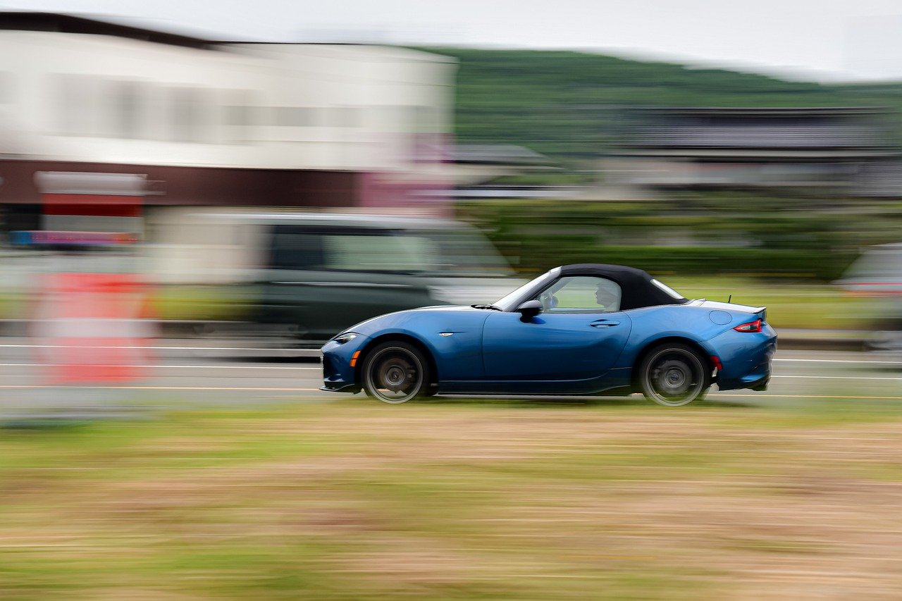 A blue vehicle in motion